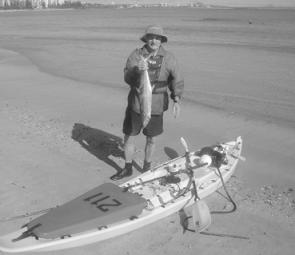 The author with a spotty mackerel, the ideal target for offshore kayak fishers.